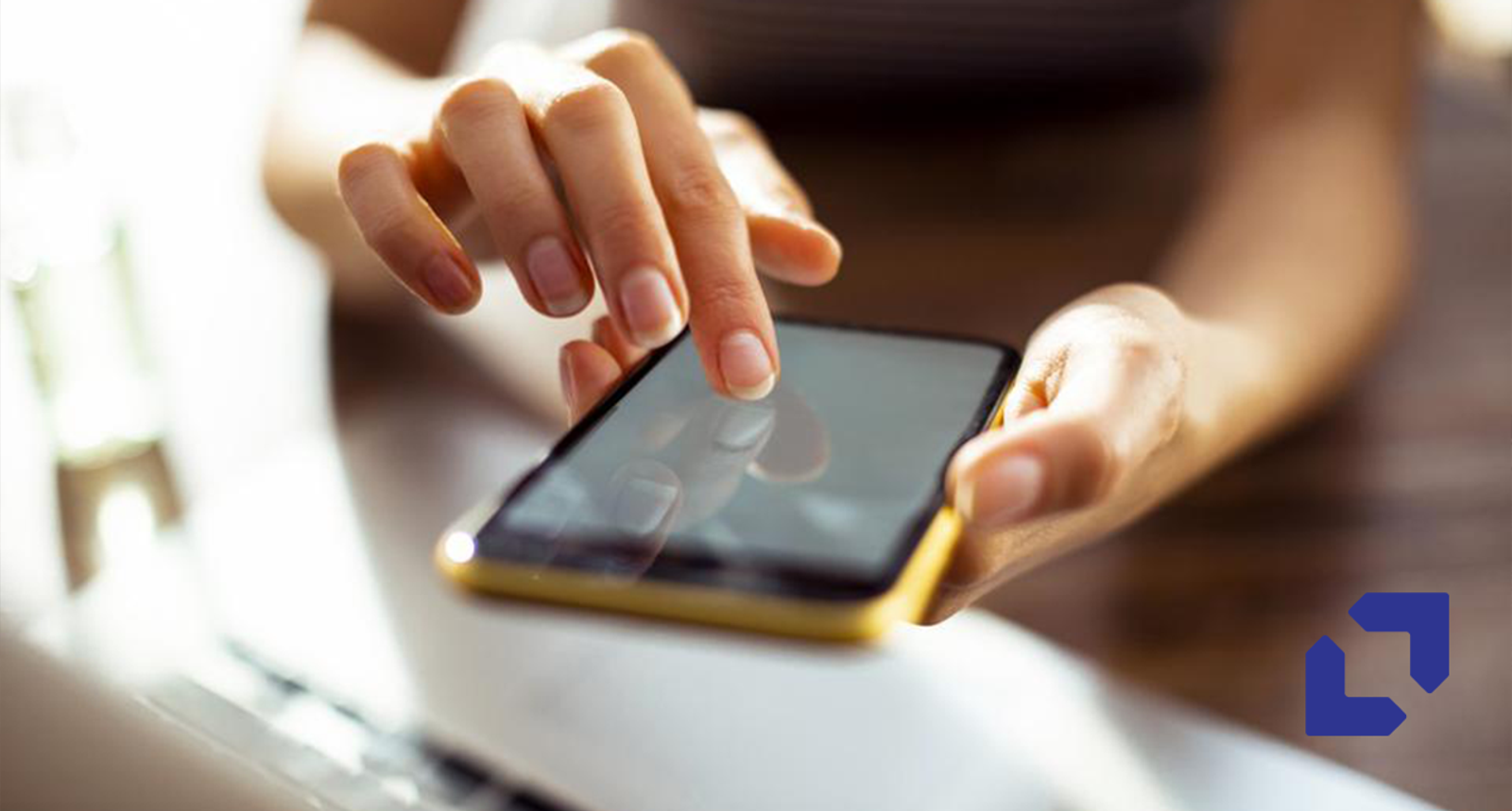 Close-up of a hand tapping a smartphone screen