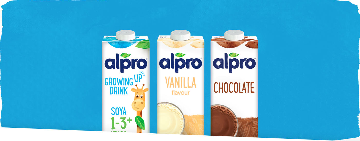 Alpro Growing Up, Vanilla and Chocolate soya drink cartons against a bright blue background