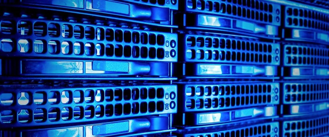 Rows of blue-lit servers in a data center rack