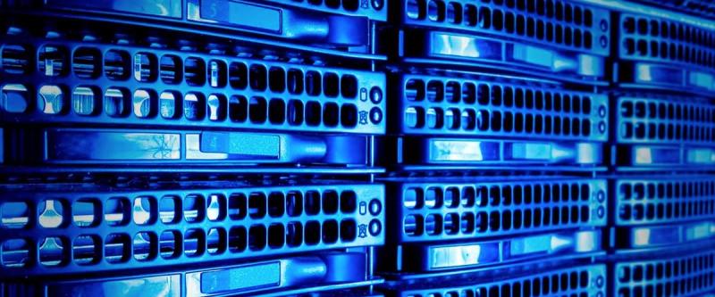 Rows of blue-lit servers in a data center rack