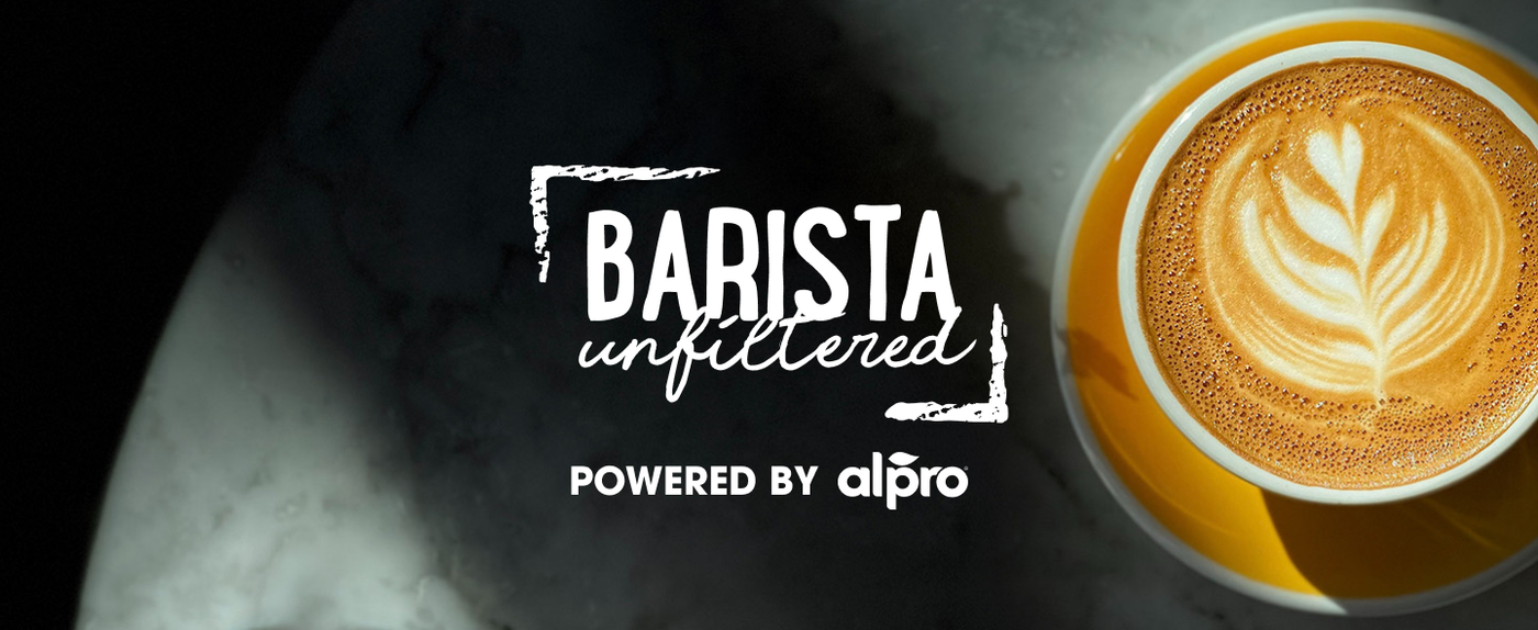 Barista Unfiltered, powered by Alpro, branding beside a latte with leaf-pattern foam art