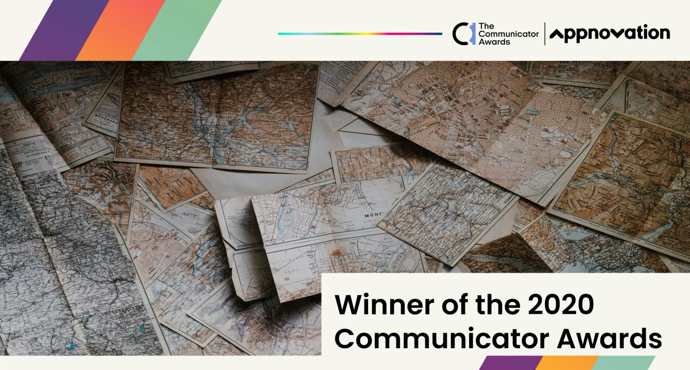 Scattered vintage maps with a banner announcing winner of the 2020 Communicator Awards