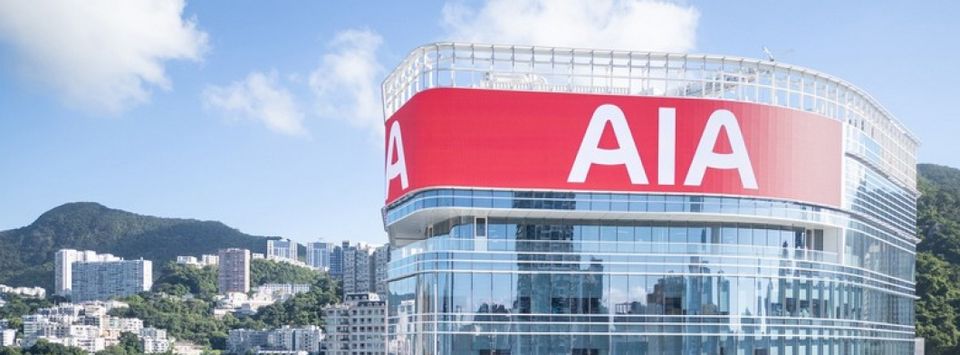 AIA's high-rise office building with a large red AIA logo on its facade