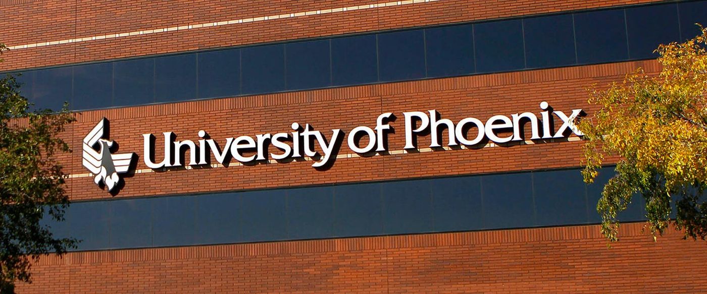 University of Phoenix signage on the exterior of its campus building
