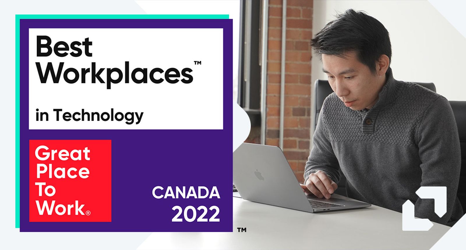 Man working on a laptop at a desk beside a 2022 Best Workplaces in Technology Canada badge