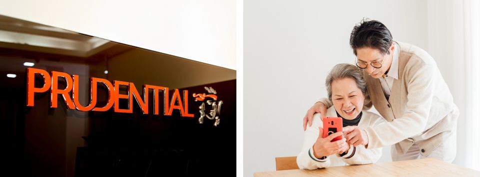 Illuminated Prudential sign beside an older woman and her son looking at a phone together
