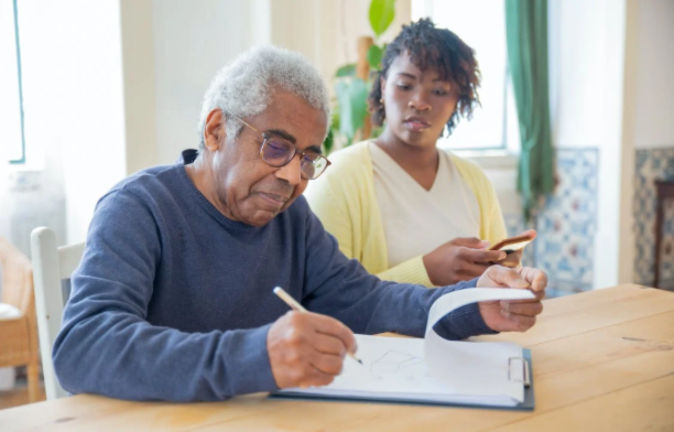 elderly man preparing his will