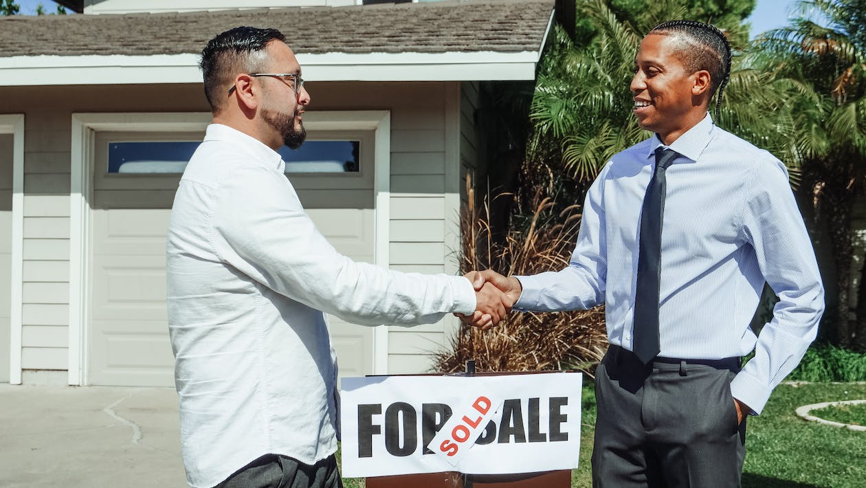 two men concluding a real estate sale