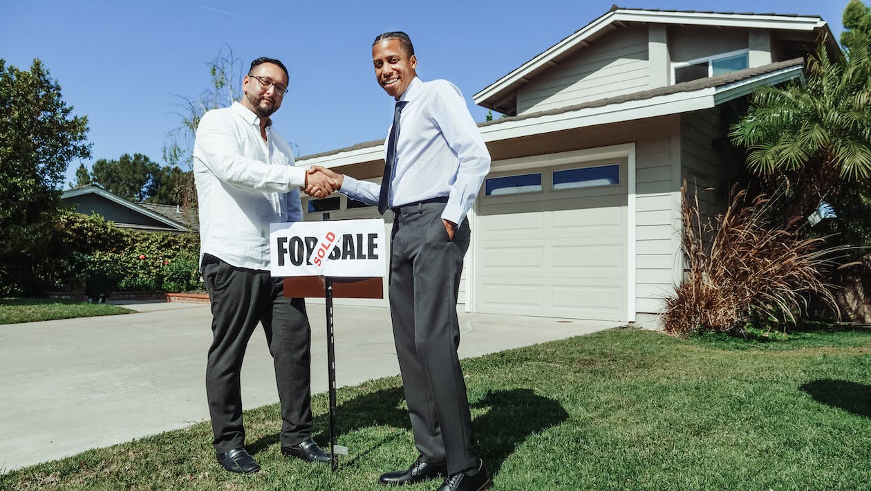real estate agent and client concluding a purchase