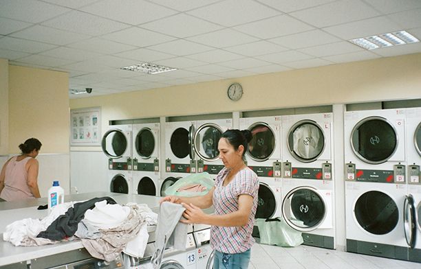 women at a laundromat