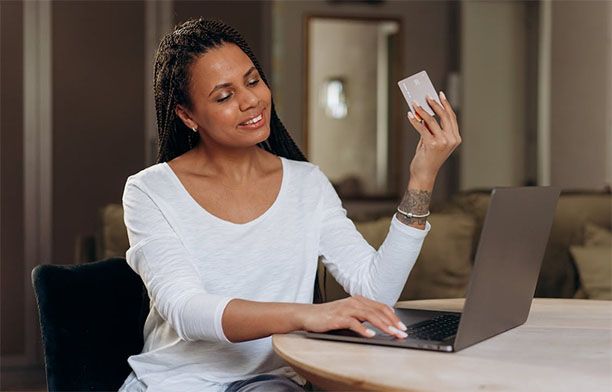 woman amused by her credit card debt