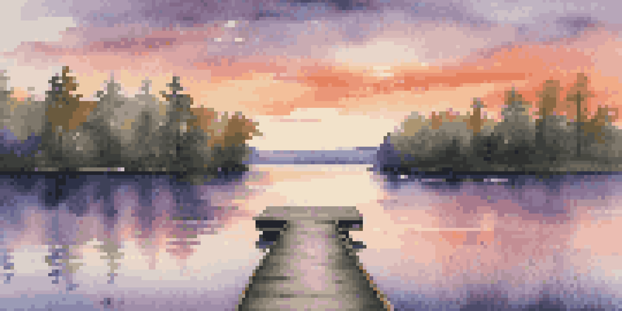 A tranquil sunset over a calm lake with colorful reflections and a wooden dock.
