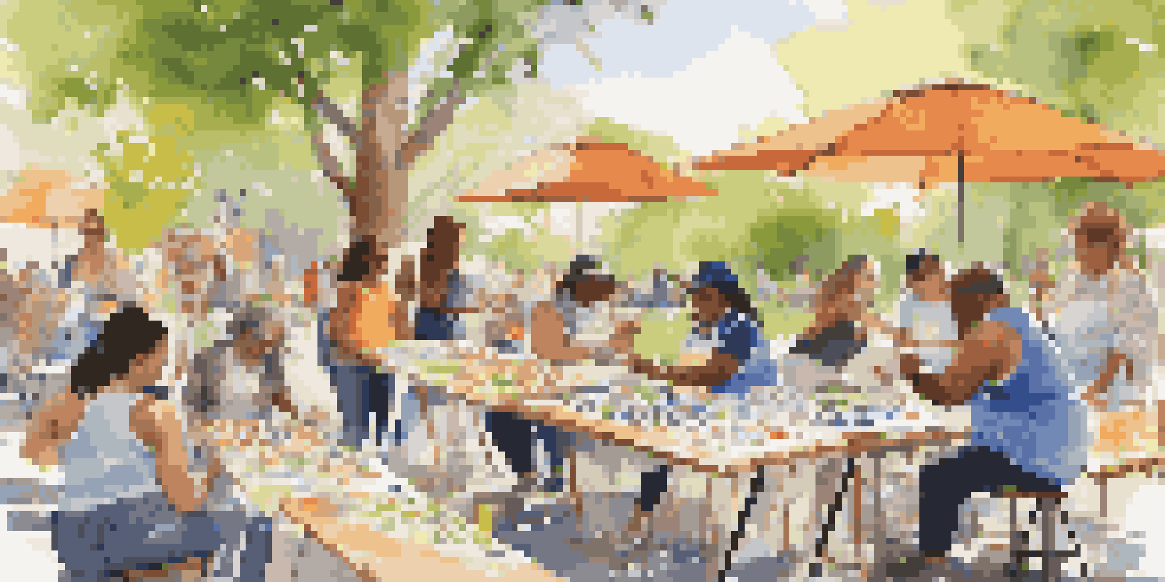 A diverse group of people participating in a community art workshop outdoors, creating colorful paintings and enjoying a collaborative atmosphere.