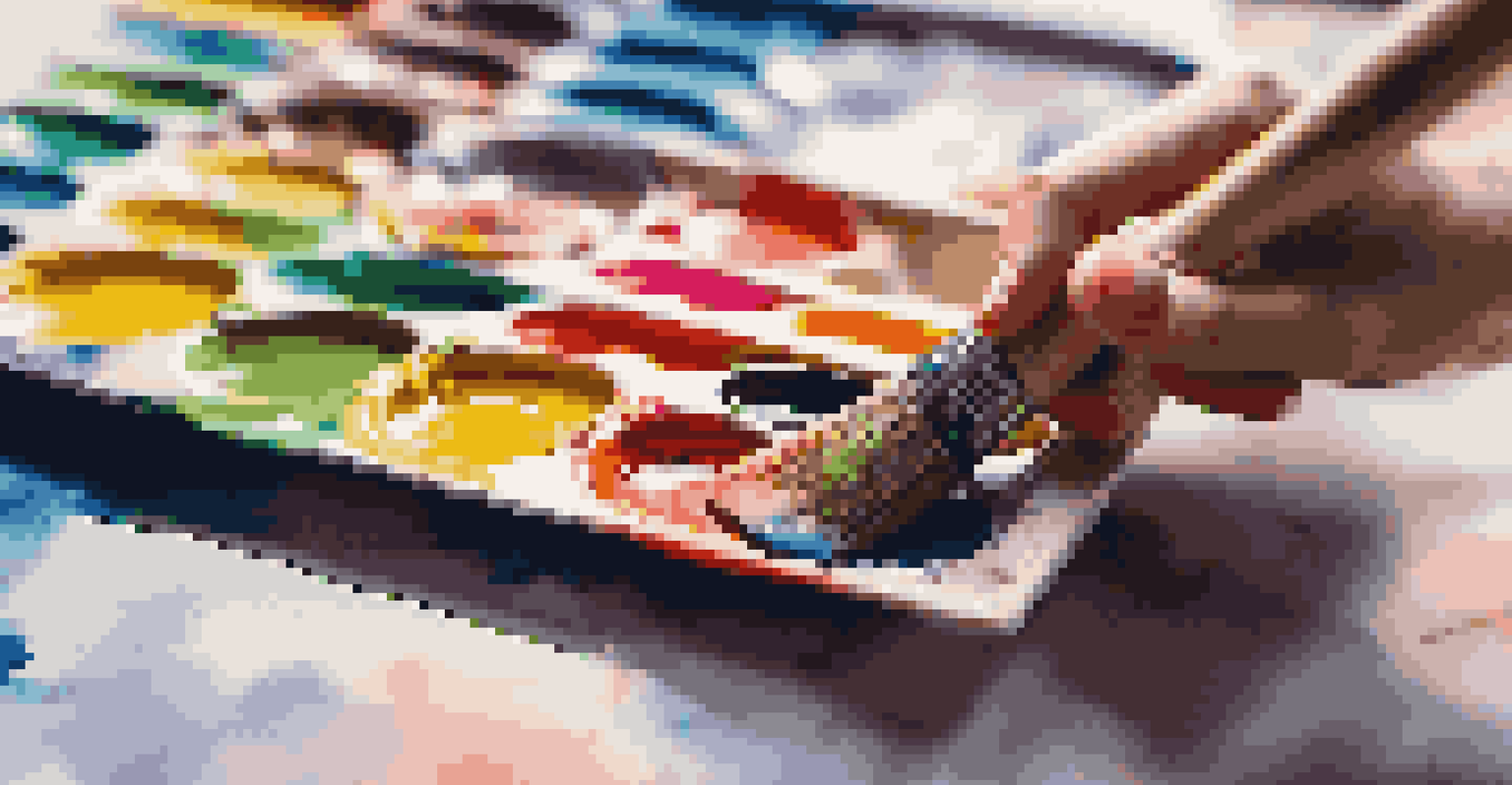A close-up of a hand using a large, textured paintbrush with vibrant paint, surrounded by art supplies and colorful artwork.