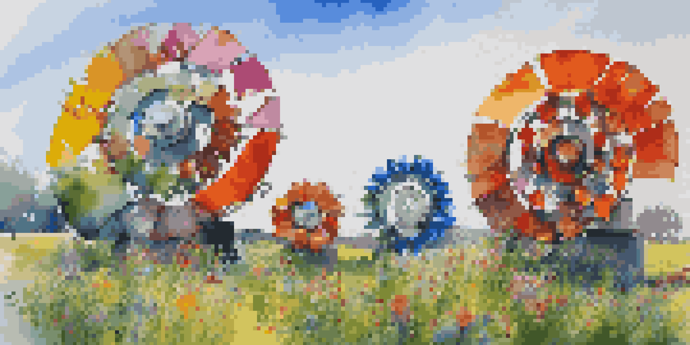 An outdoor art installation with large colorful sculptures made from recycled materials, under a bright blue sky and surrounded by greenery.