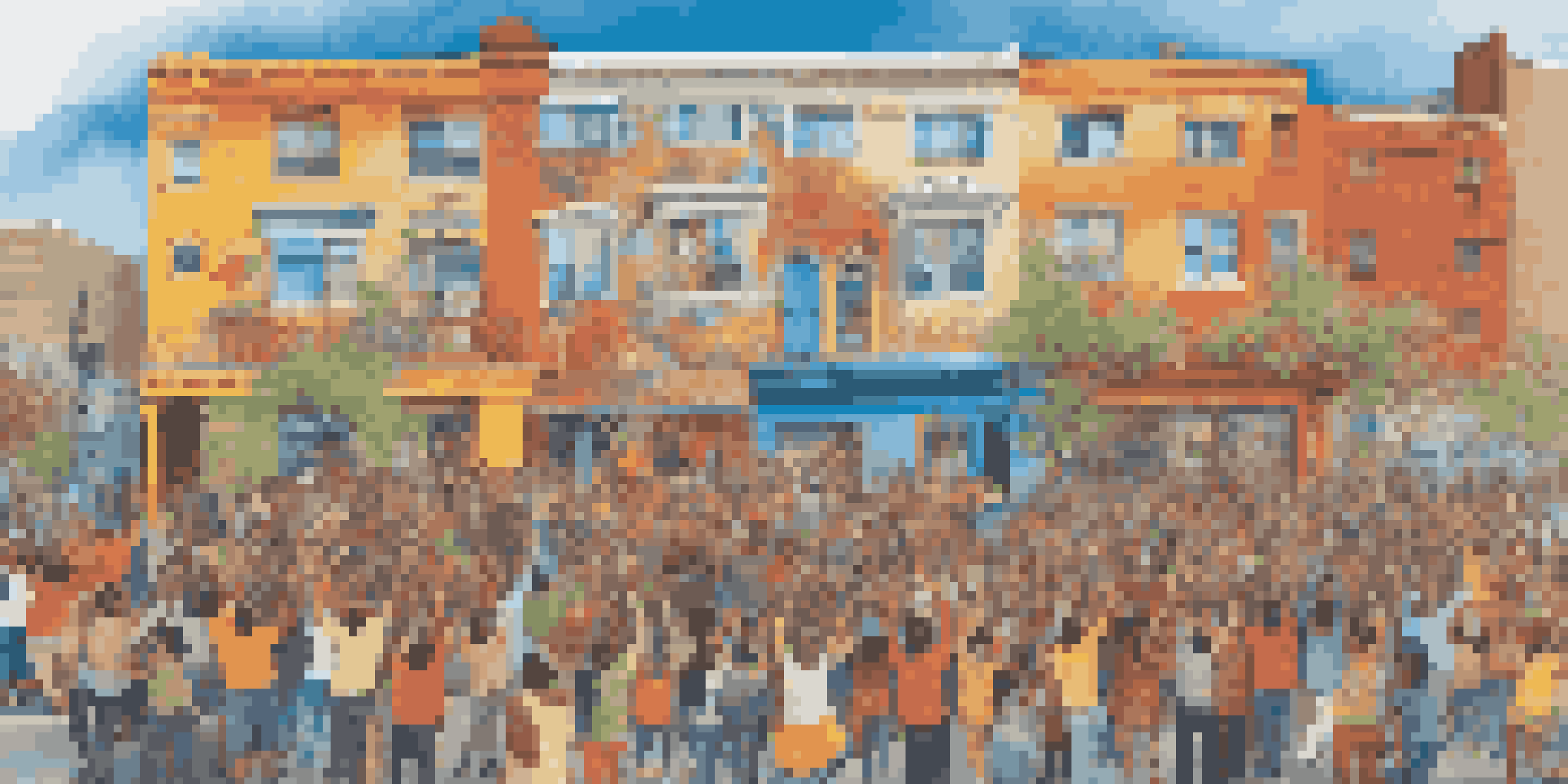 A group of diverse artists and residents collaboratively painting a colorful mural that represents their cultural heritage, with paints and brushes visible, and a bright blue sky overhead.