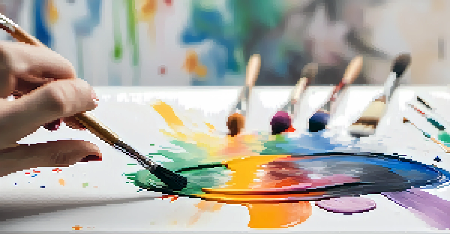 A close-up of a hand with paint stains holding a paintbrush above a blank canvas.