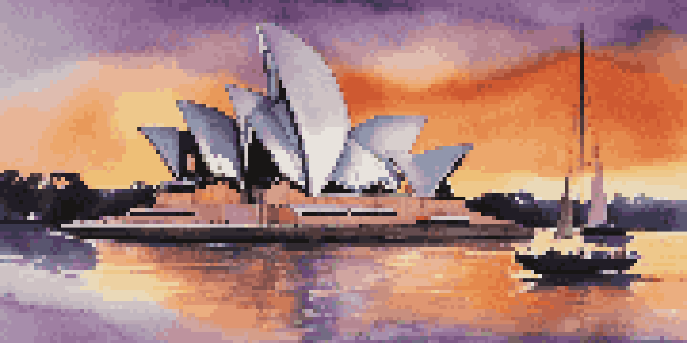 The Sydney Opera House illuminated by the sunset, with reflections in the water and boats in the foreground.