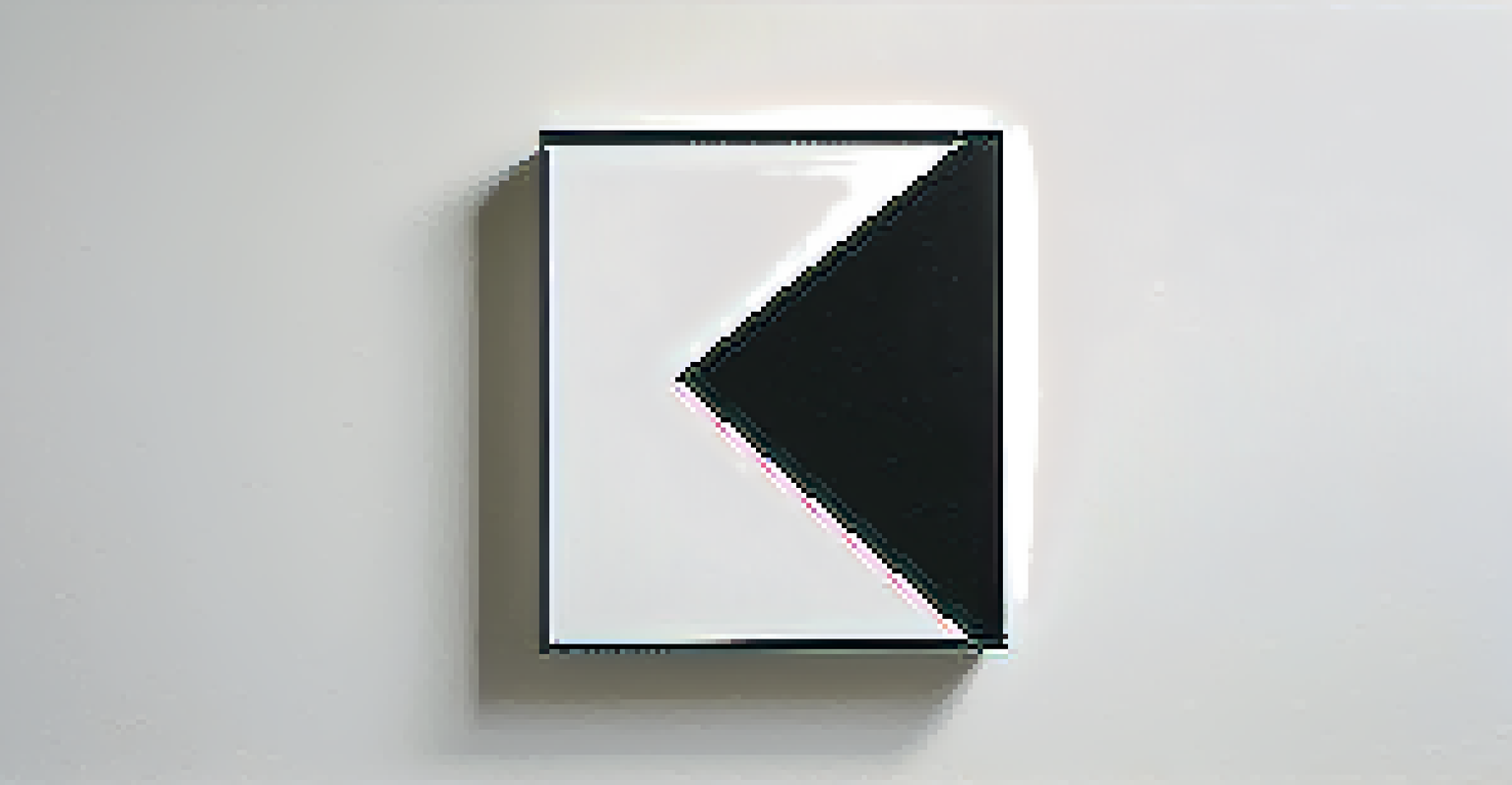 A close-up view of a bold black square on a white wall, showcasing the contrast between the glossy paint and the matte surface.