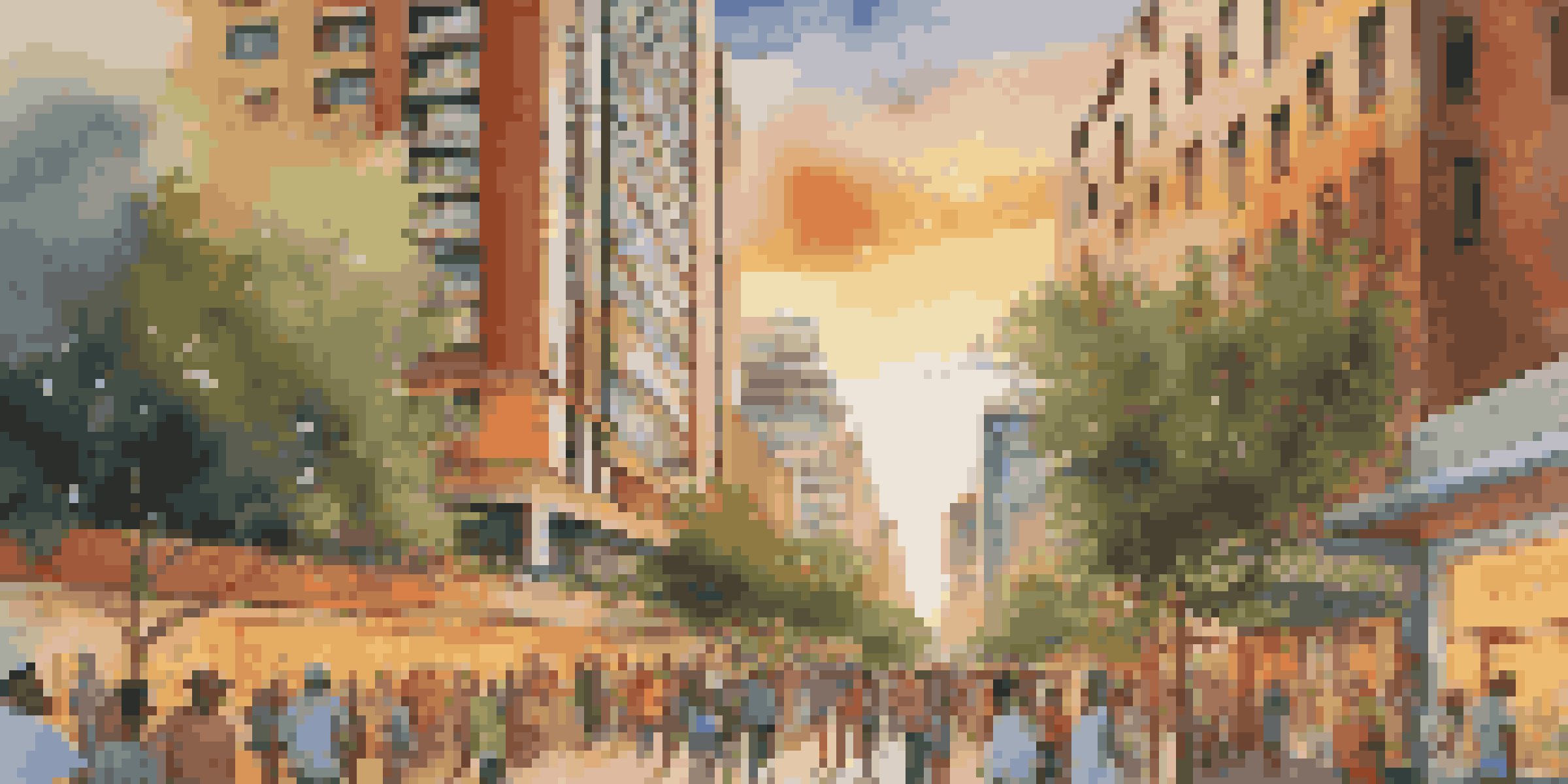 A tall building with a colorful mural depicting local culture, surrounded by lush greenery and people, under a warm sunset.