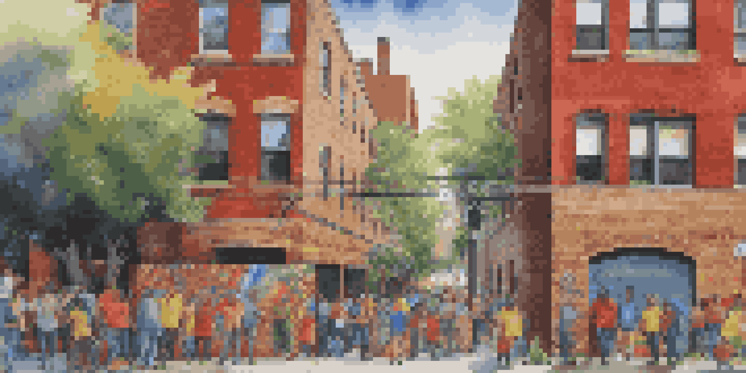 A colorful street mural of a local hero on a brick wall, surrounded by plants and urban activity.