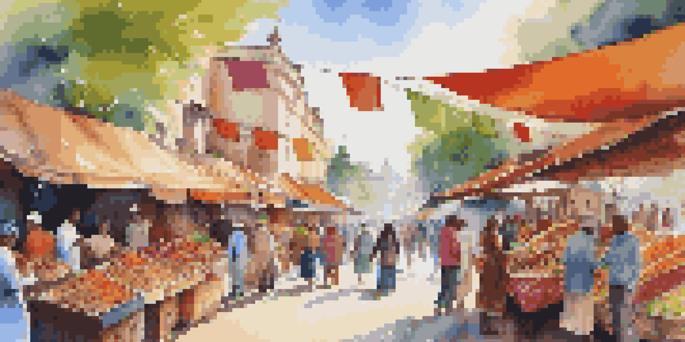 A busy street market filled with stalls displaying colorful textiles, crafts, and food, with diverse people interacting under a sunny sky.