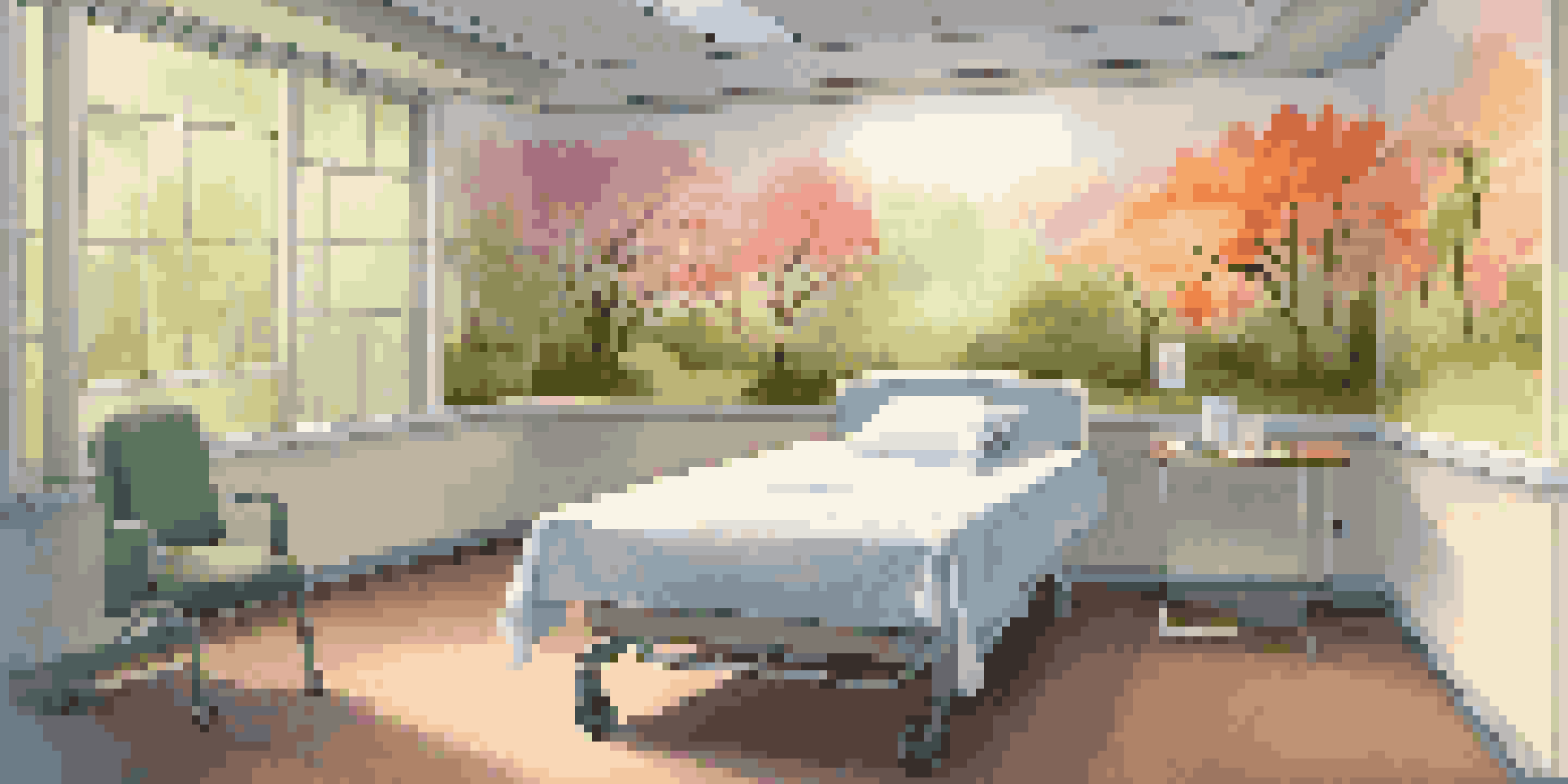 A peaceful hospital room with colorful nature murals and a comfortable bed, featuring an art station.