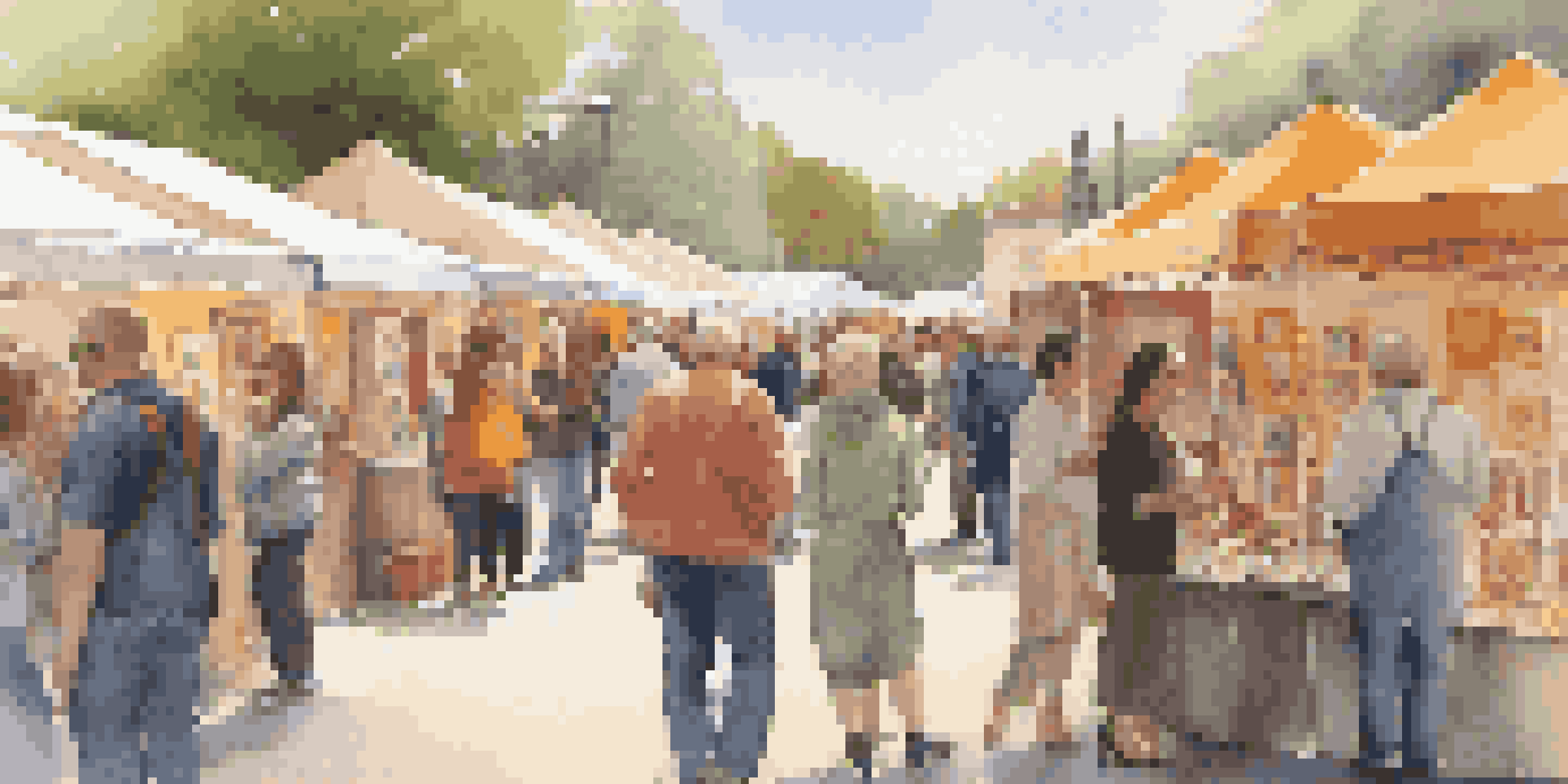 A lively art fair with artists and collectors interacting, showcasing a variety of artworks in a colorful environment.