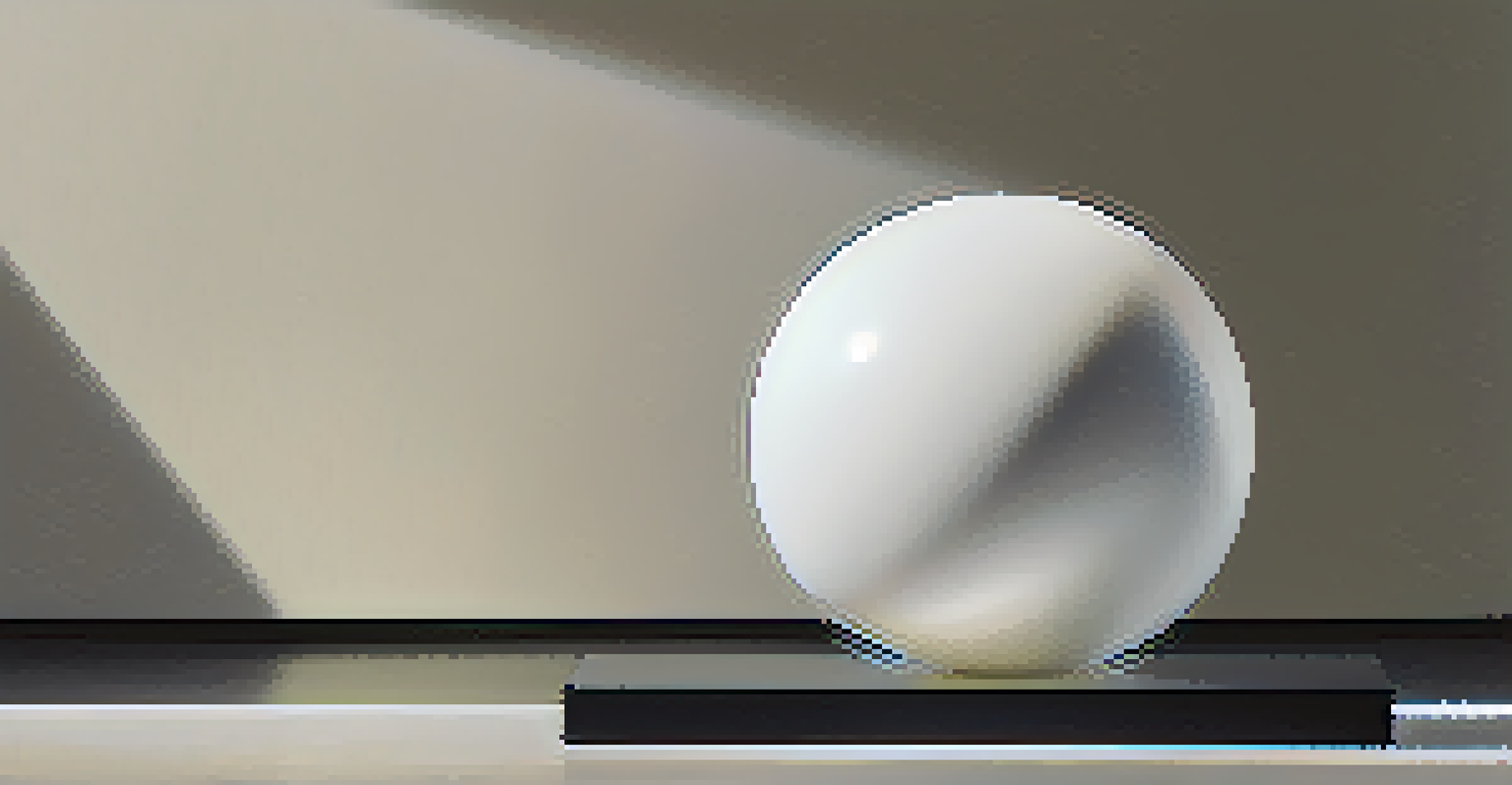 A close-up of a white marble sphere on a black base, illuminated by a spotlight, showcasing its texture and veining.