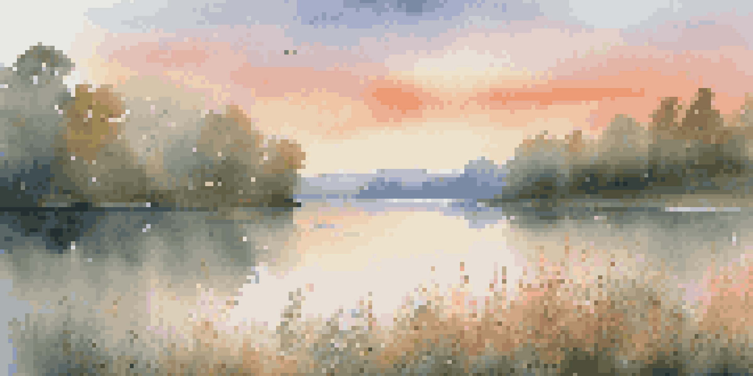 A peaceful lake at sunrise with colorful skies and mist, surrounded by green trees and wildflowers.
