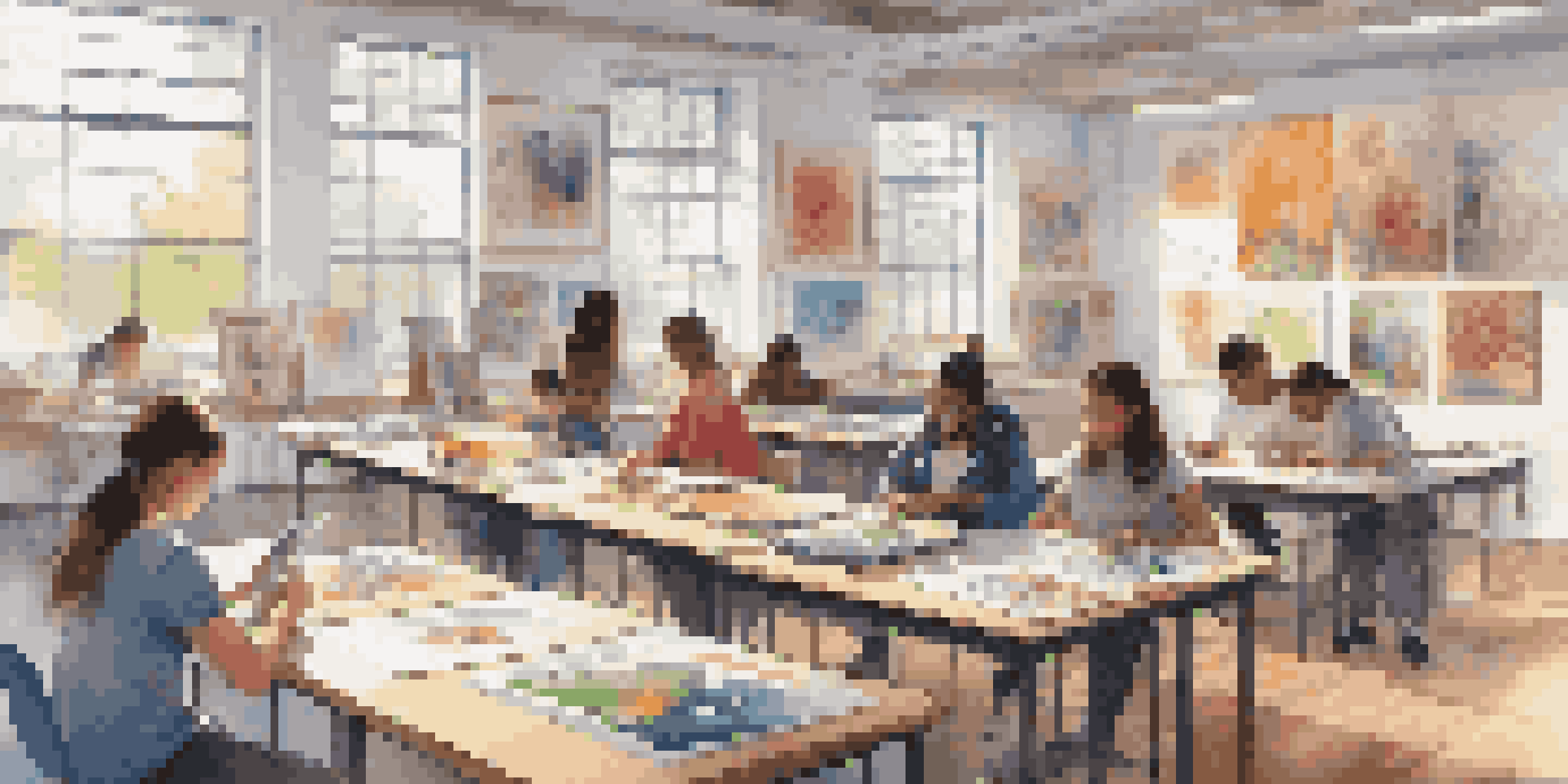 A diverse group of students engaged in art projects, with watercolors and digital tablets in a bright classroom.