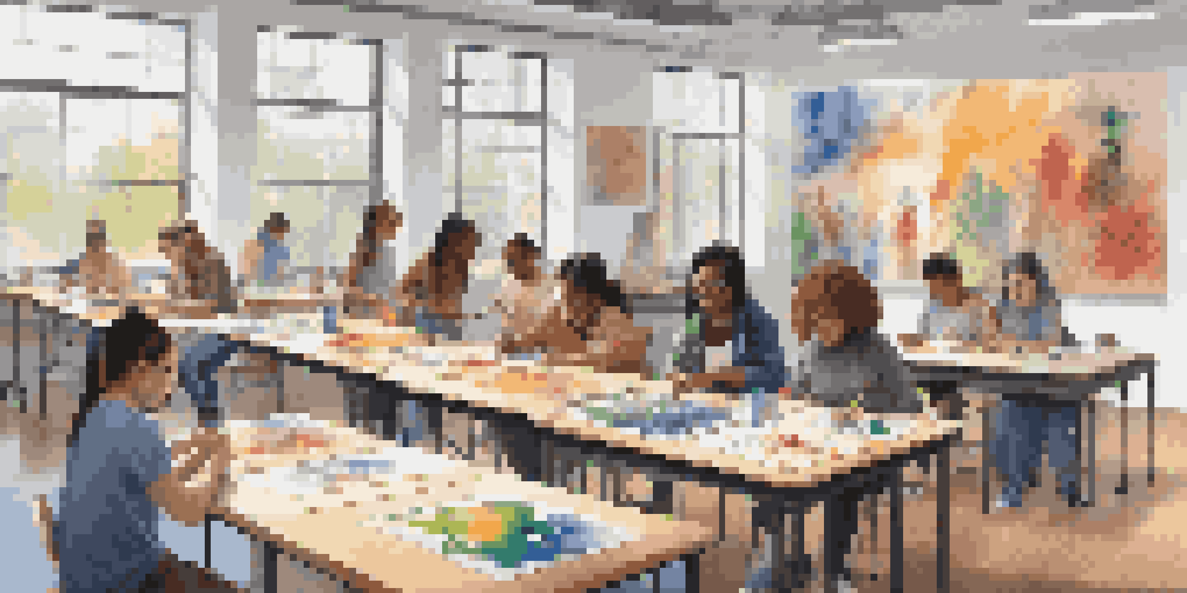 A diverse group of students in an art classroom working together on various art projects, showcasing inclusivity and creativity.