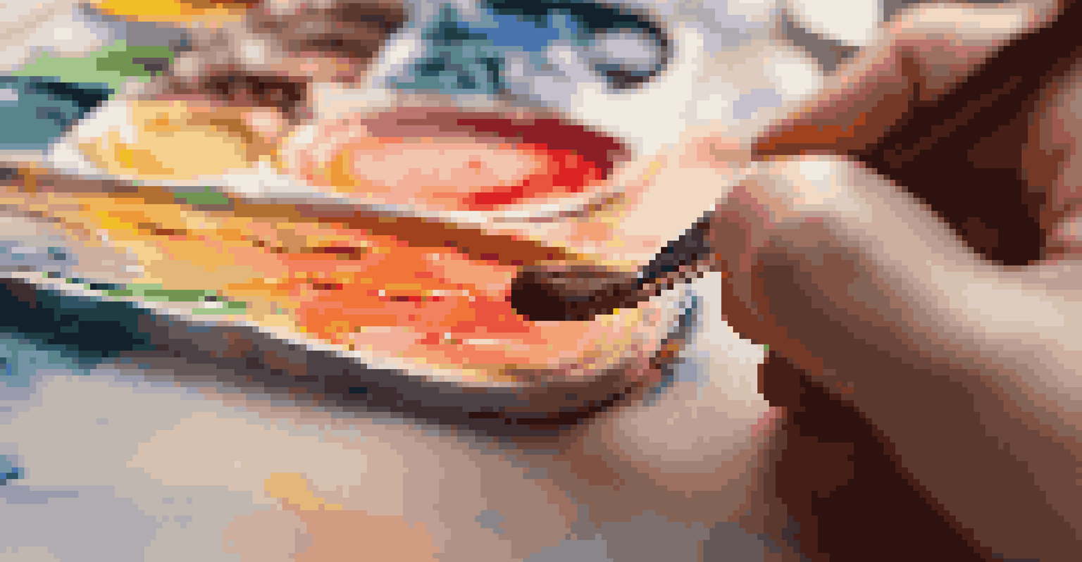 A close-up image of a hand with a paintbrush above a colorful canvas, highlighting the texture of the paint and brush.