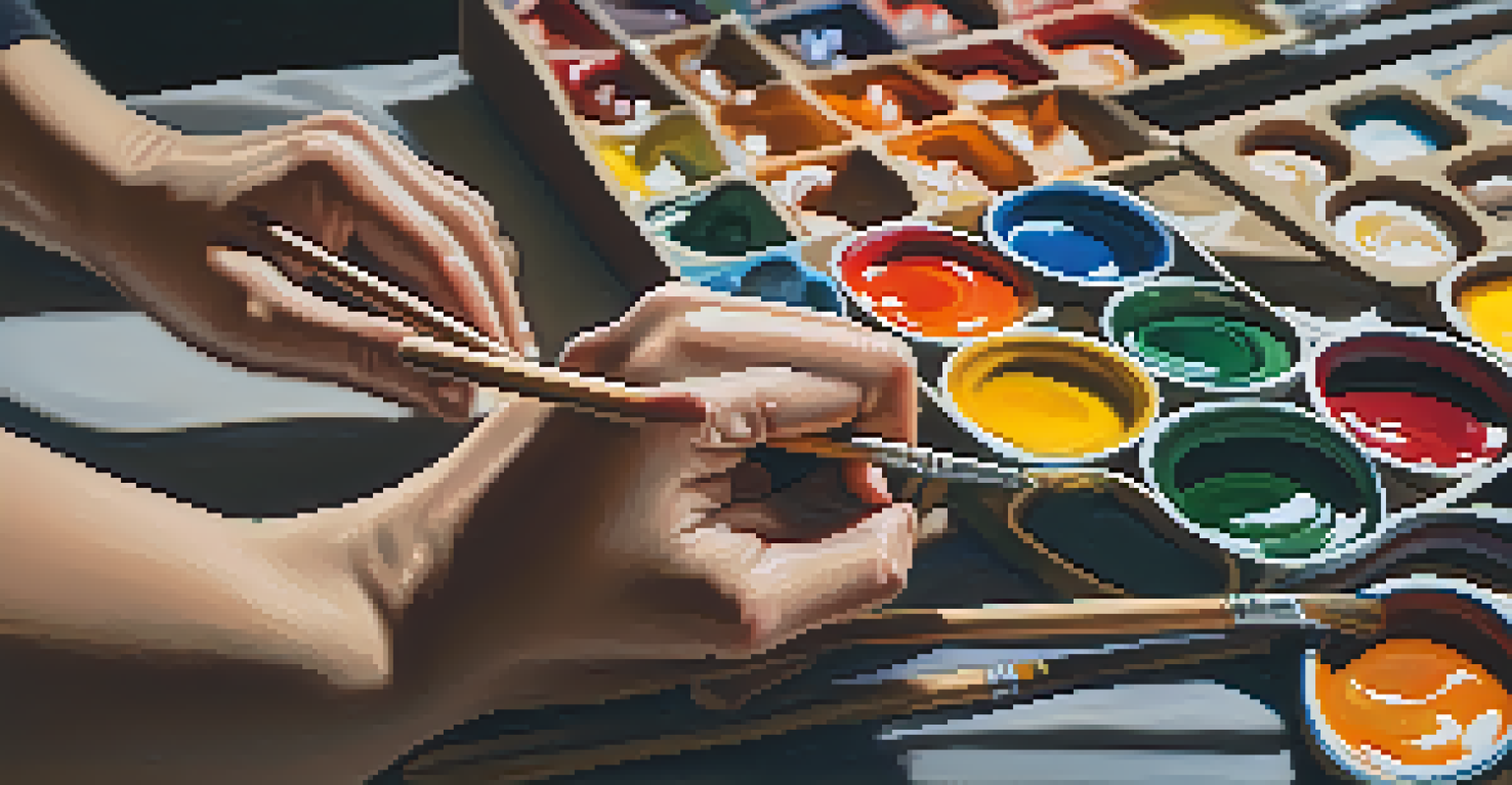 Close-up of an artist's hands mixing paint colors on a palette.