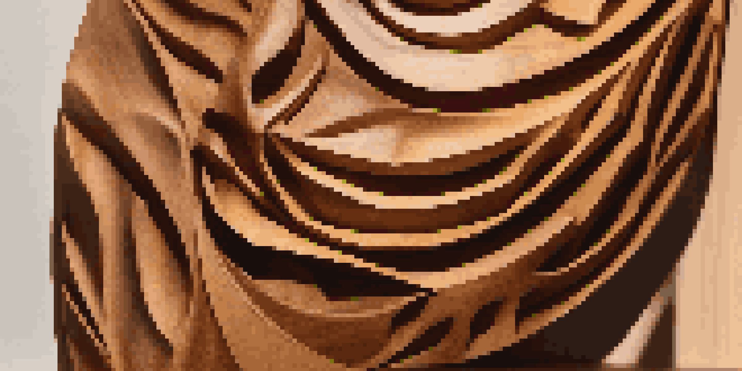 A detailed view of a wooden sculpture highlighting its grain patterns and warm colors in a softly lit gallery.