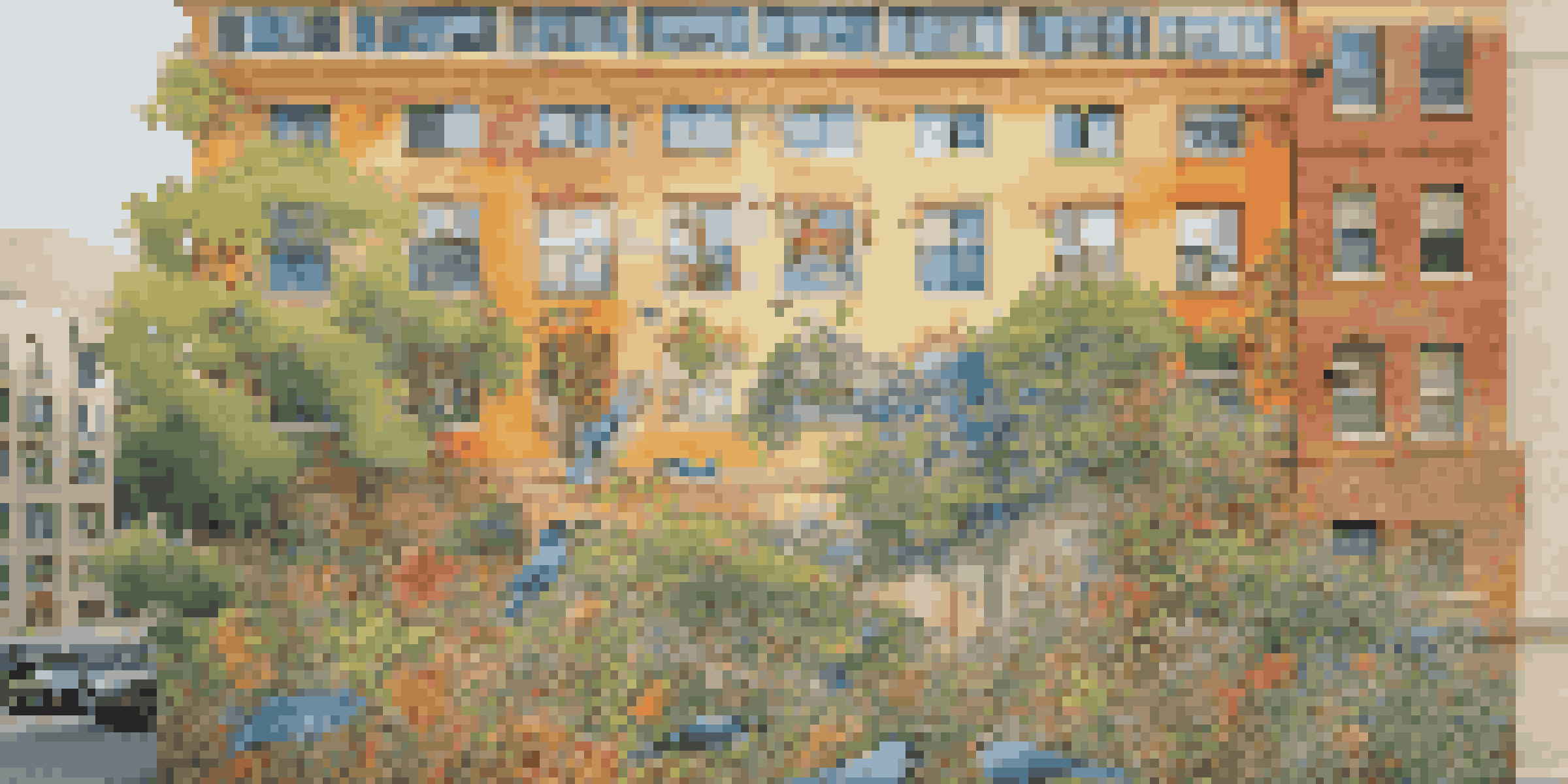 A vibrant mural illustrating a diverse ecosystem with various animals and plants, set against an urban backdrop, glowing in the afternoon sun.