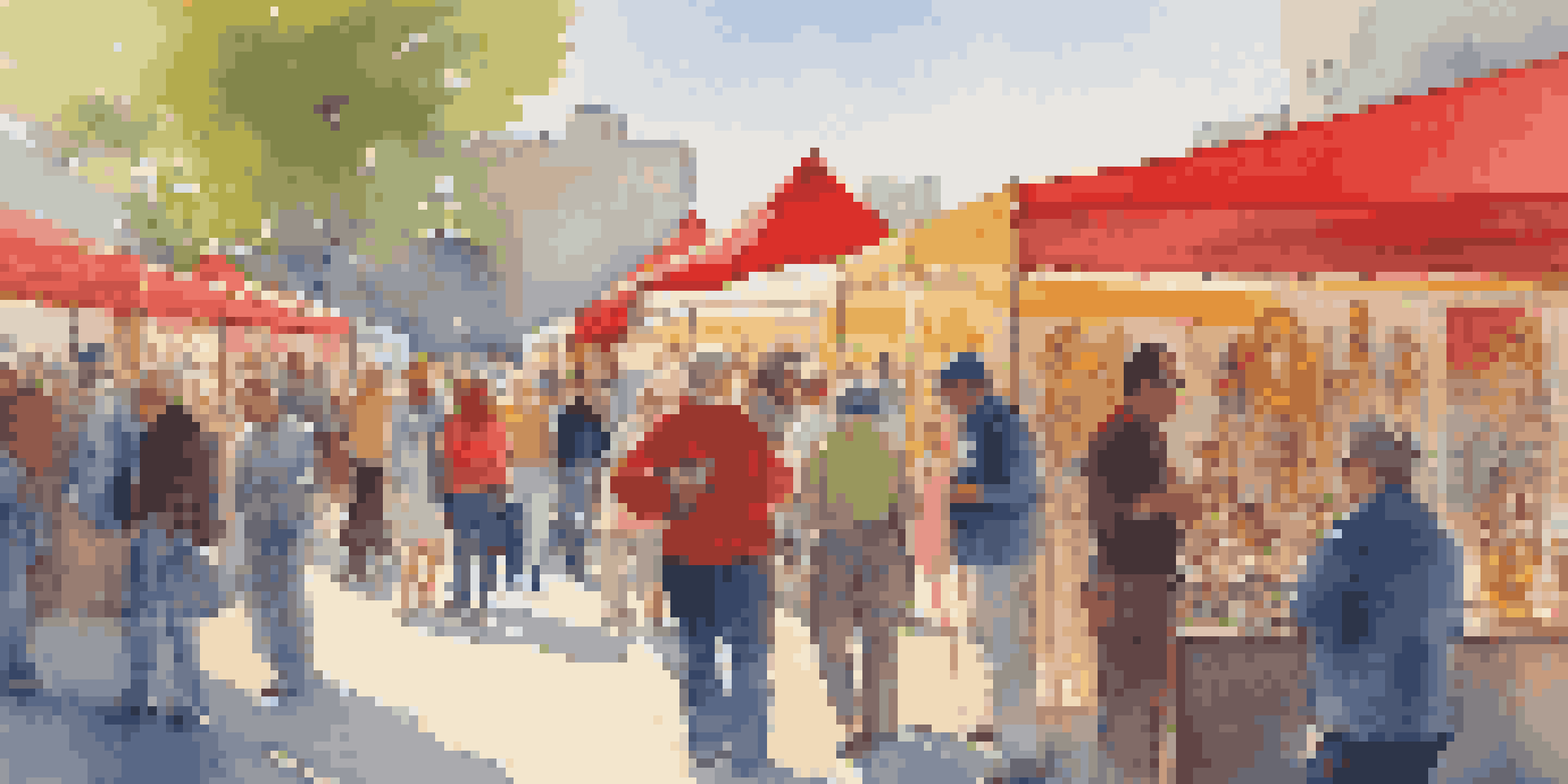 An outdoor art fair filled with colorful booths and diverse visitors appreciating various artworks.