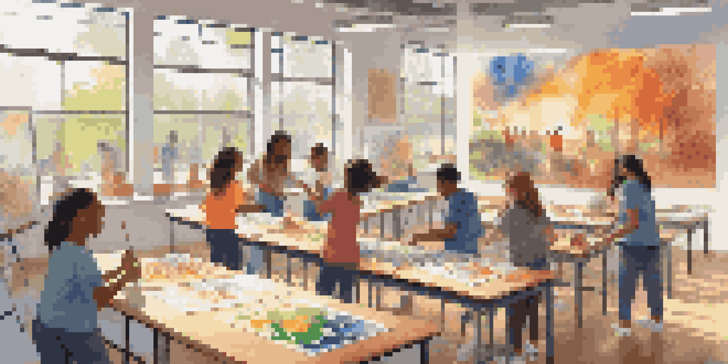 A diverse group of students working together on a colorful mural in a bright classroom, showcasing teamwork and creativity.