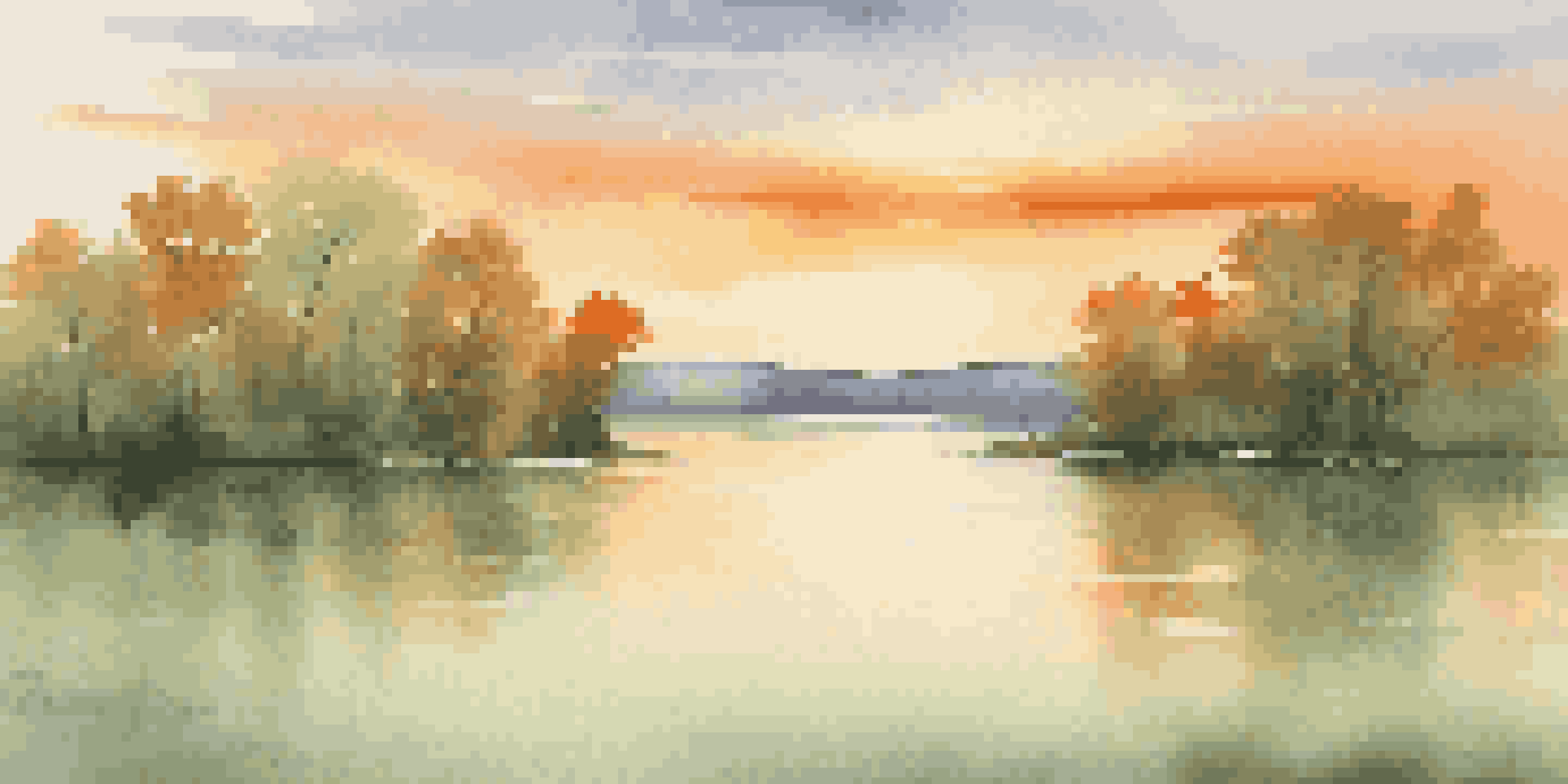 A peaceful sunset landscape over a calm lake with warm colors reflected in the water and green trees surrounding it.