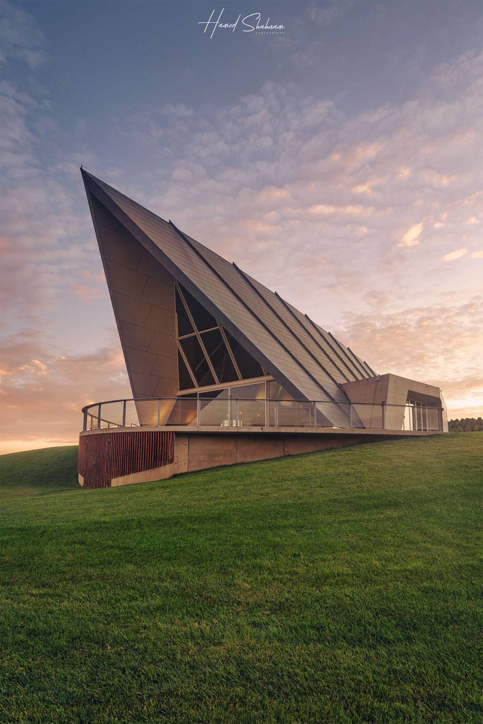 The angular Margaret Whitlam Pavilion beneath a pastel sunset sky.