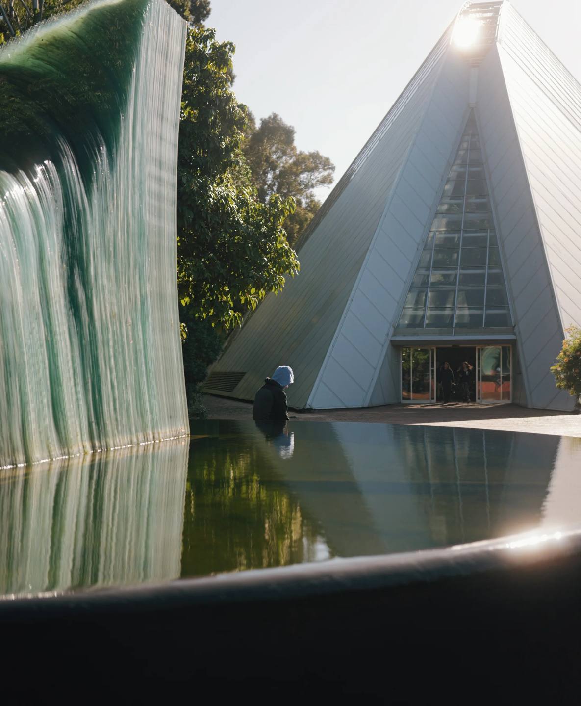 Reflections and angular architecture beside the water.