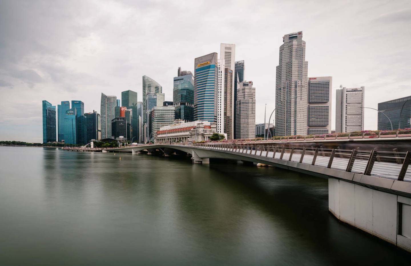A panoramic view of the waterfront skyline beneath an overcast sky.