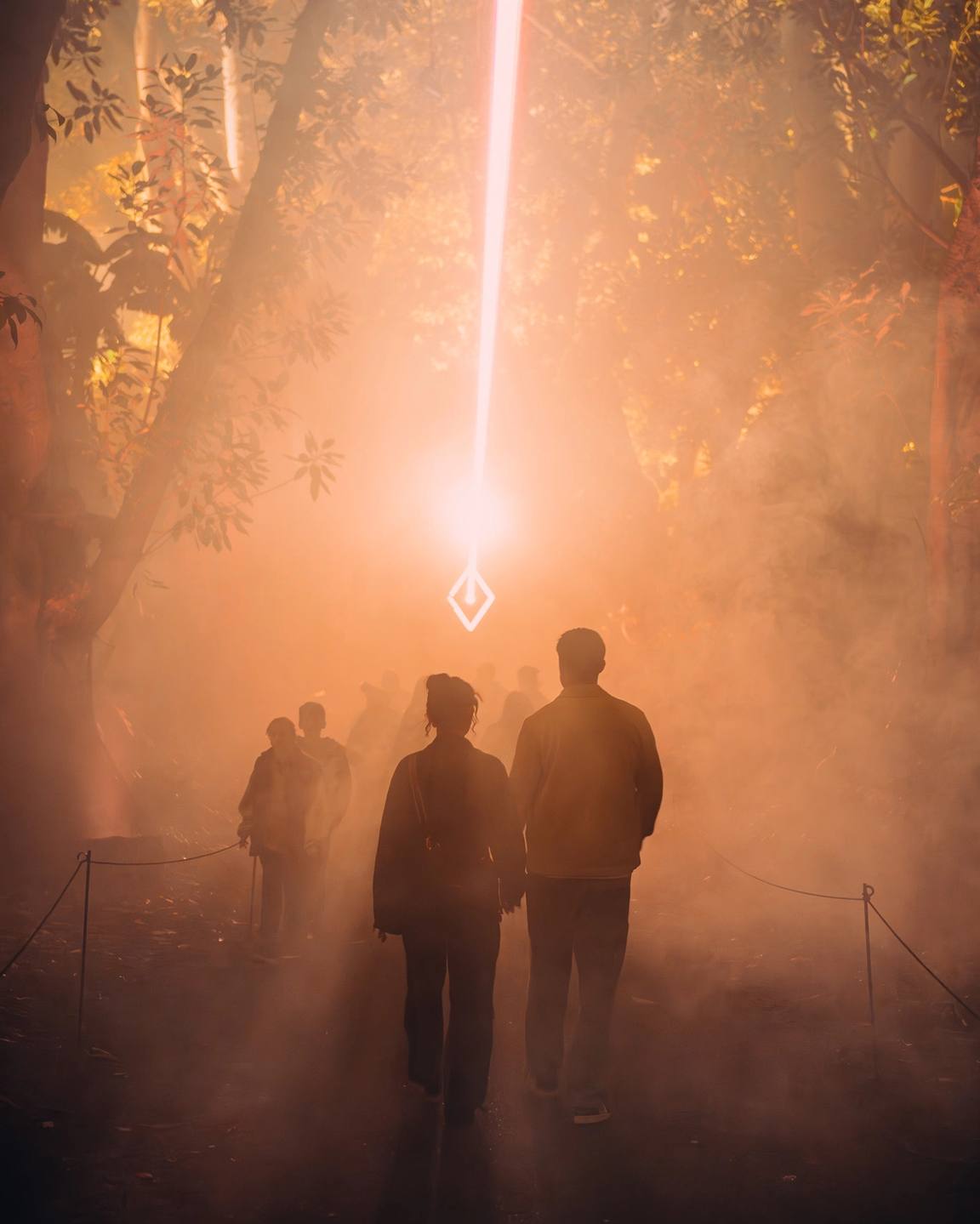 People walking into light beam