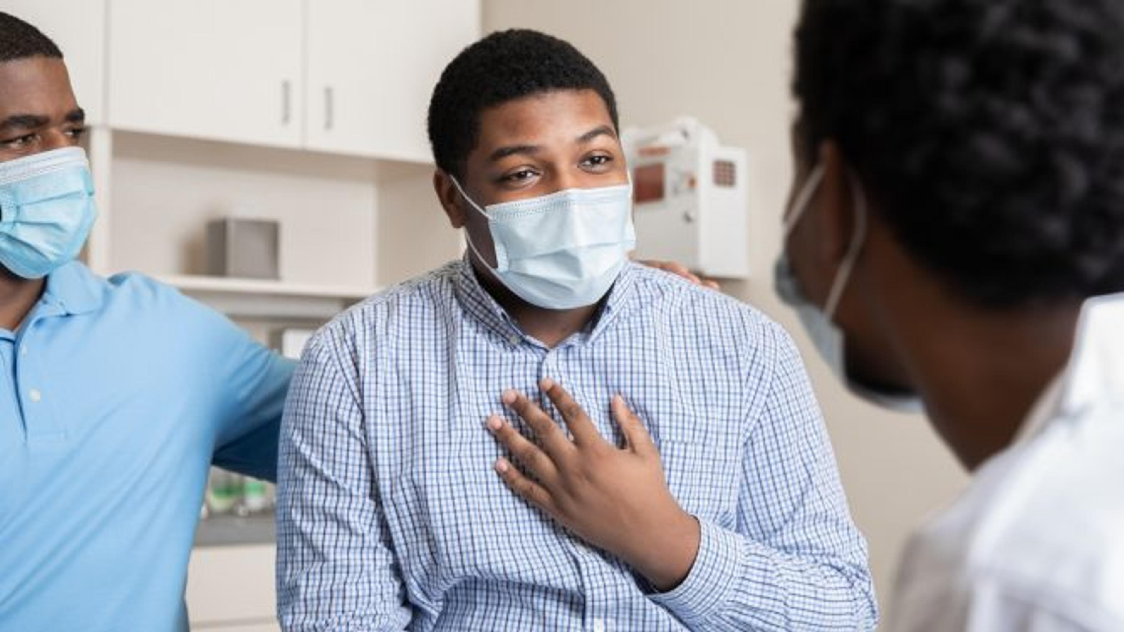 Two people speaking with a physician