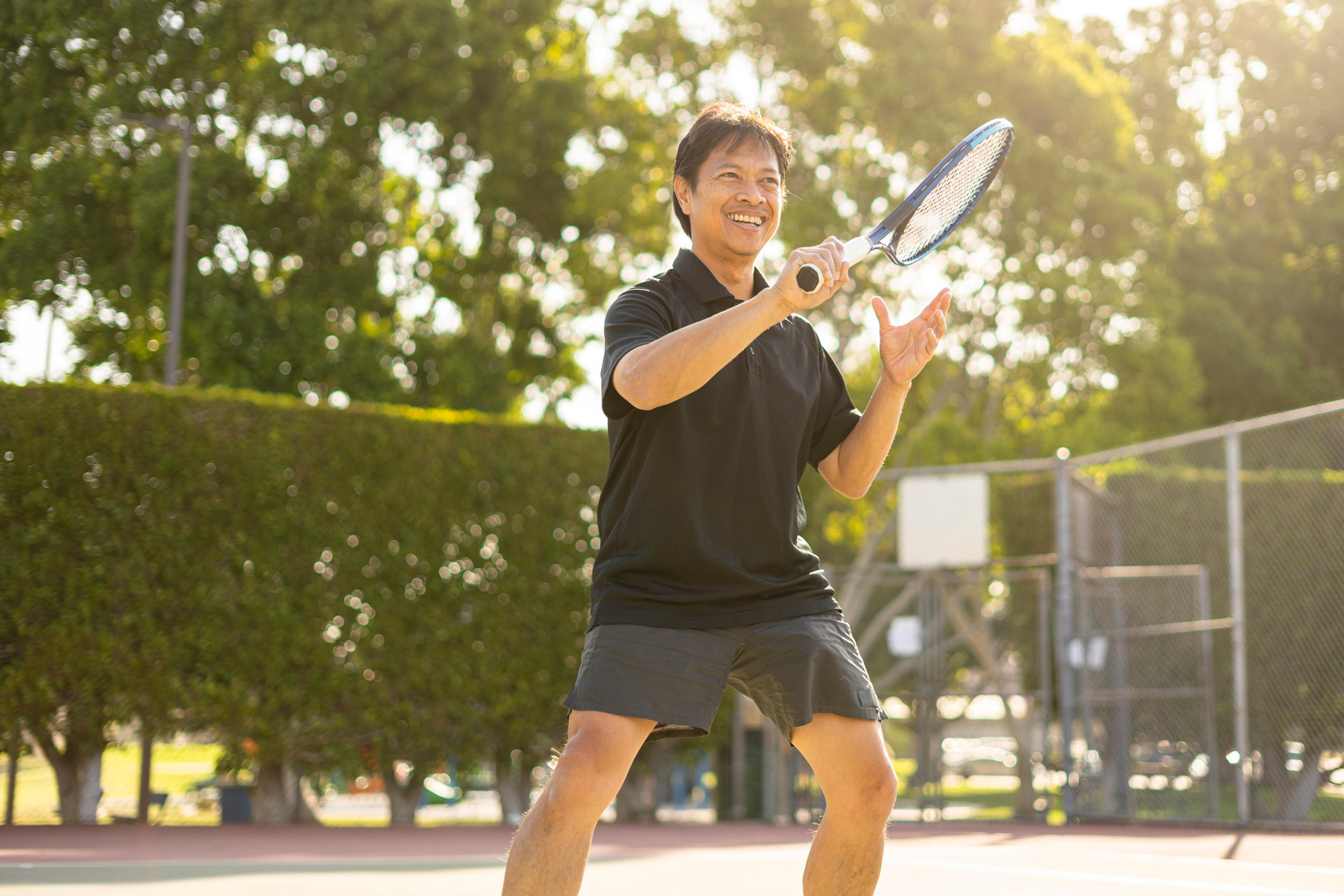 Man plays tennis staying healthy at every age