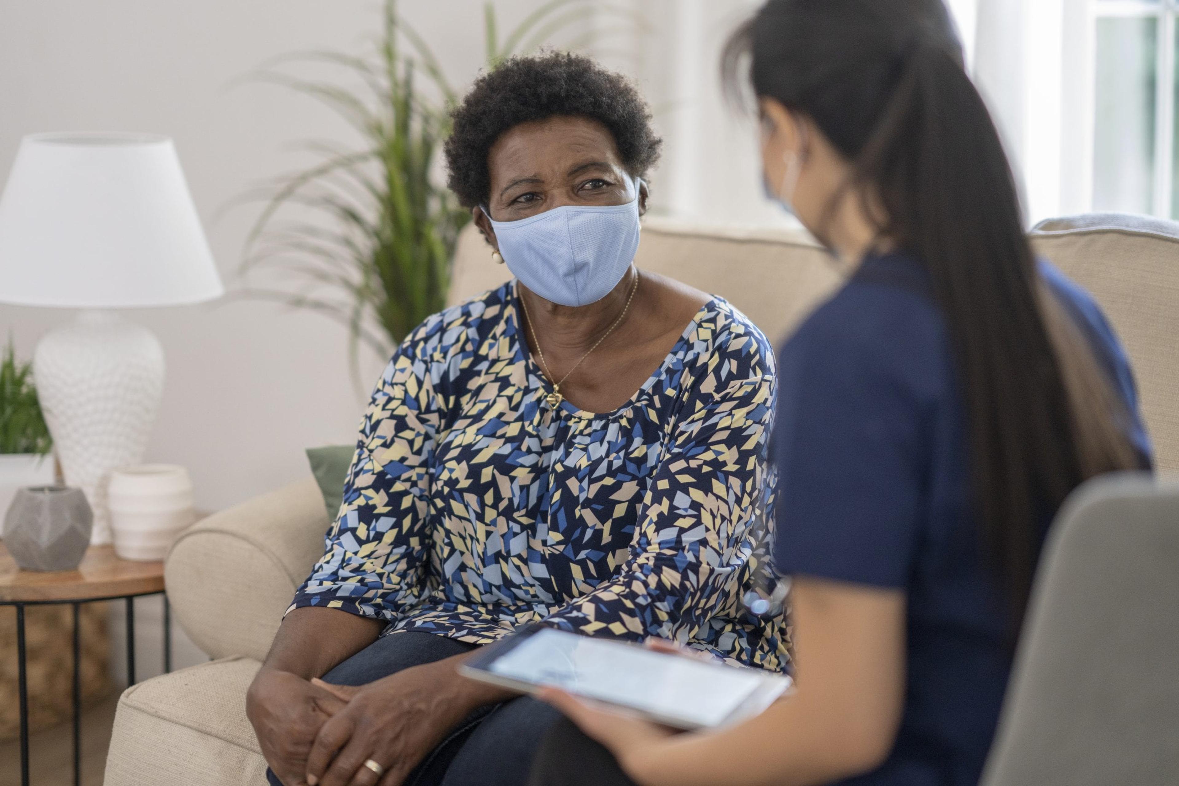 Home health care worker with patient