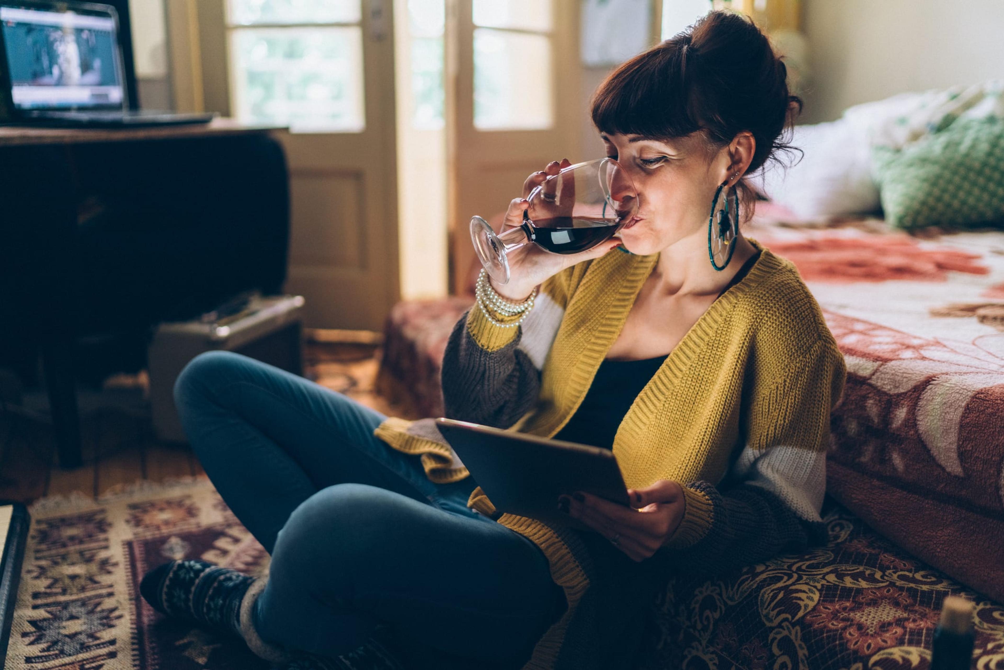 Woman drinking a glass of wine