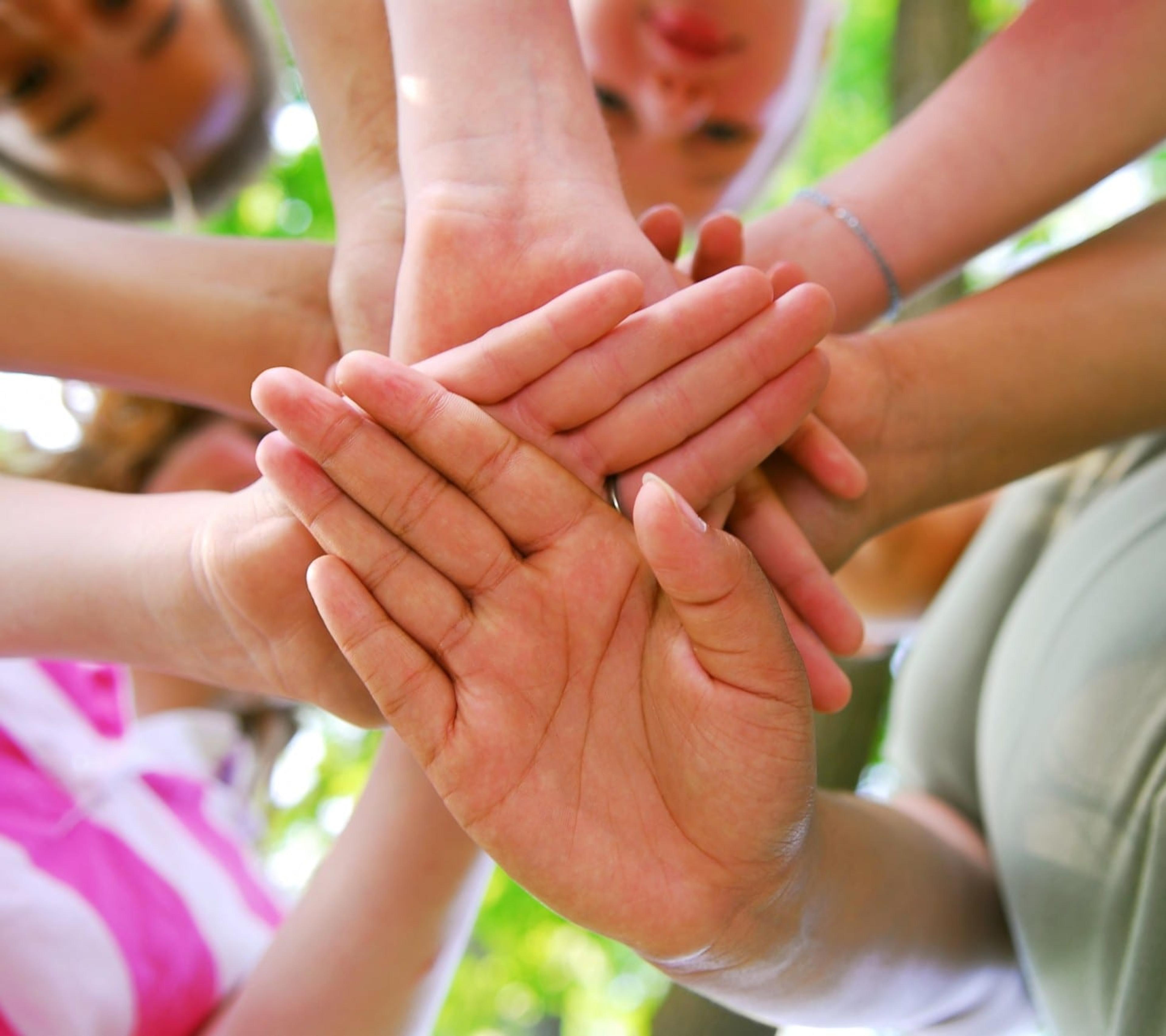 Children's' hands in a circle