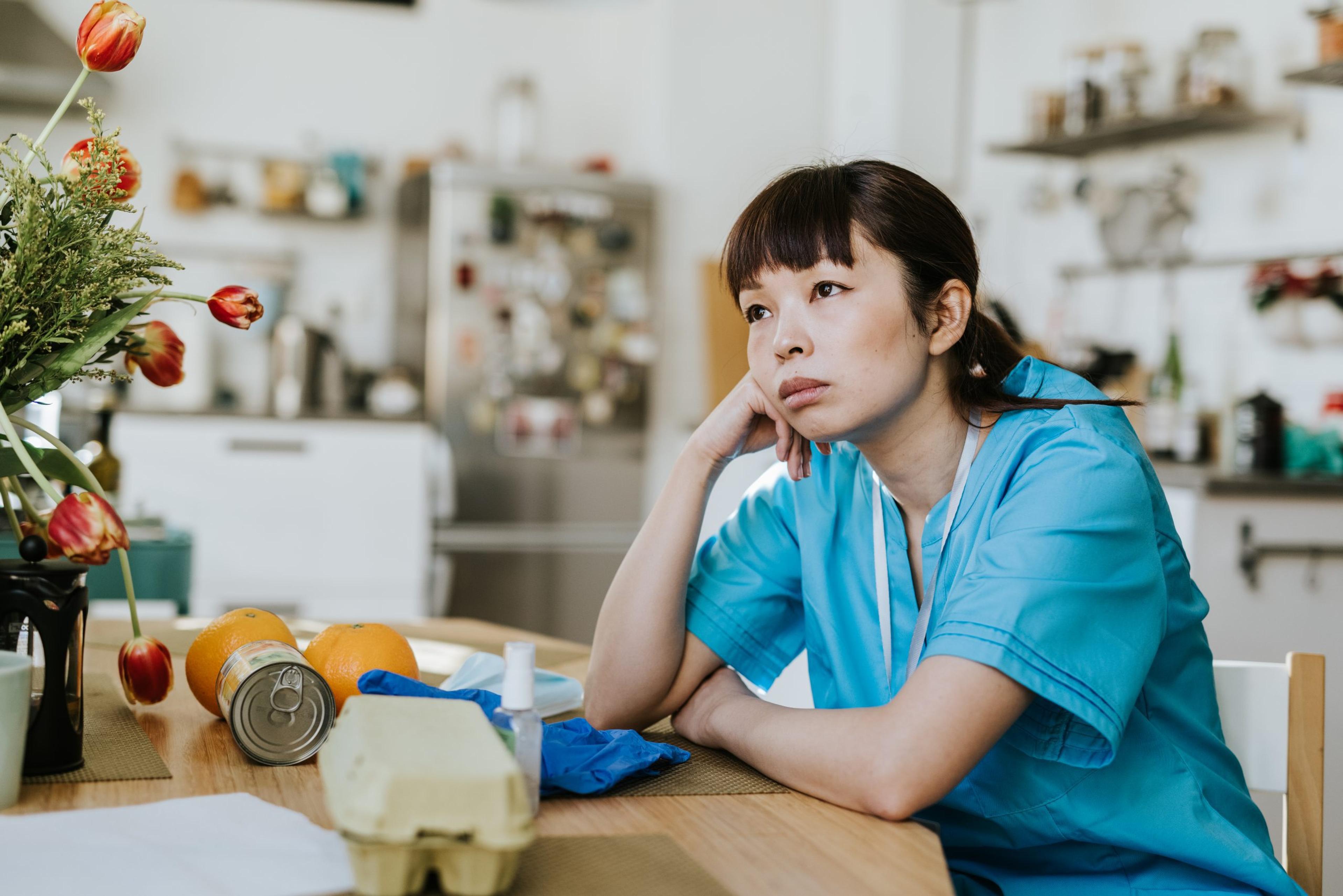 Overworked healthcare worker stressed at home