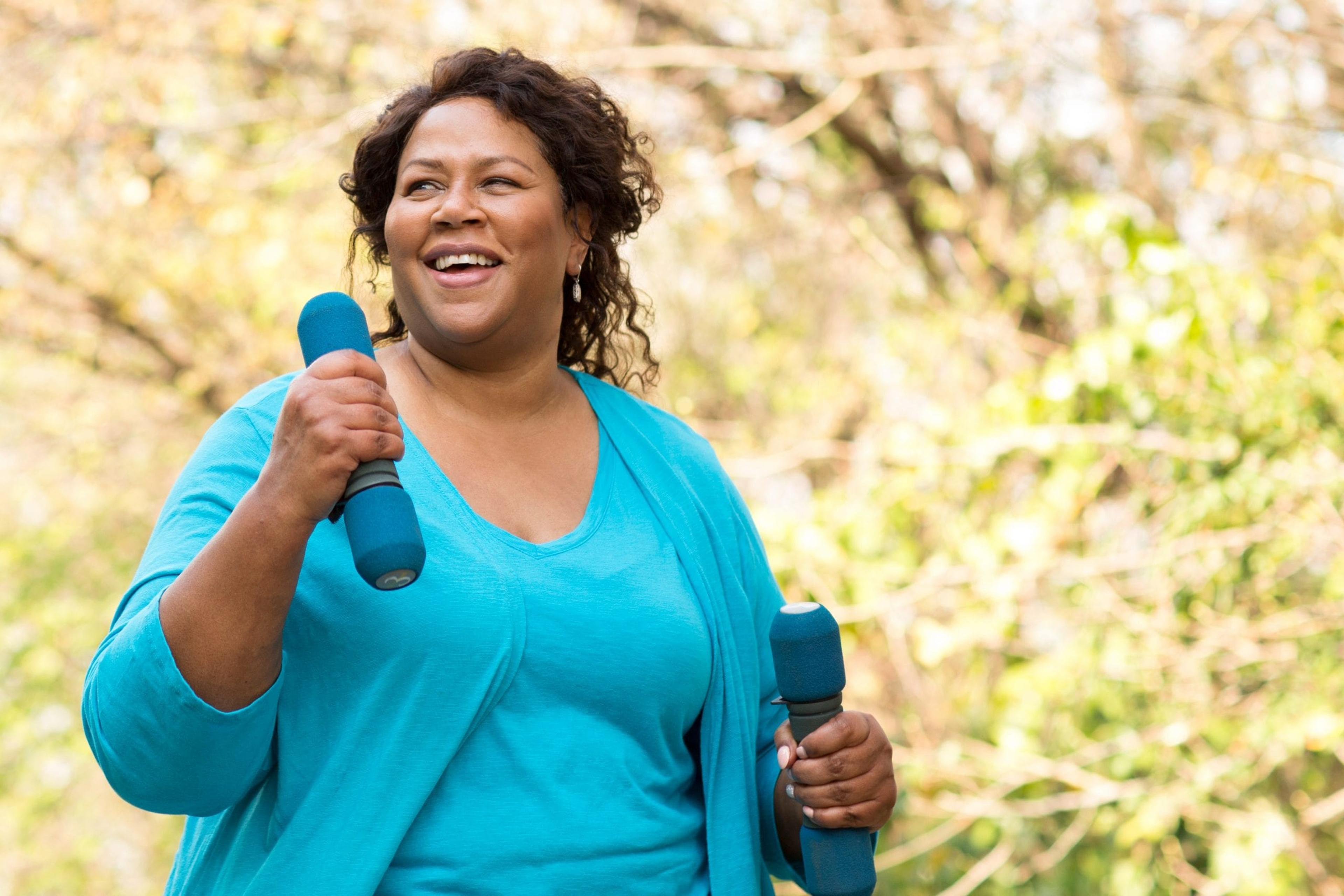 Woman walking with weights